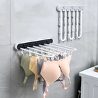 Étendoir Mural Pliable Multi-Pinces – Gain de place et Séchage Facile